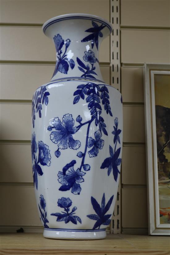 A pair of Chinese blue and white jars and cover and a pair of blue and white vases